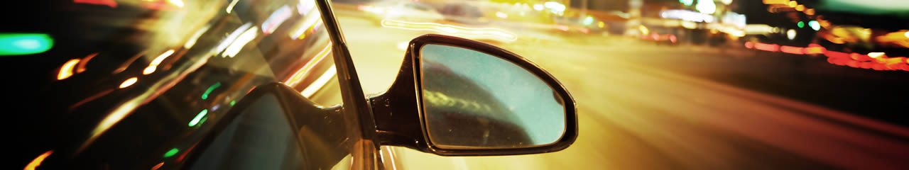 Page Banner - Rear Vision Mirror with Blurry Traffic